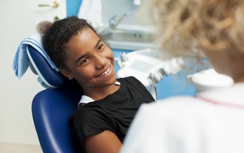 young girl in dental chair