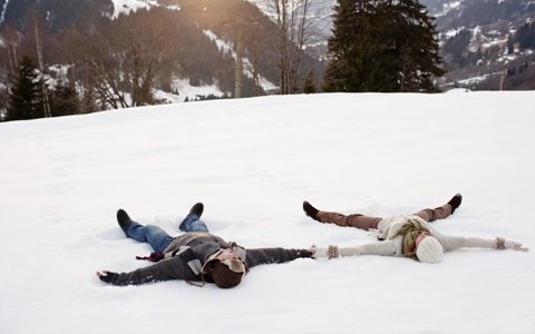 couple making snow angels