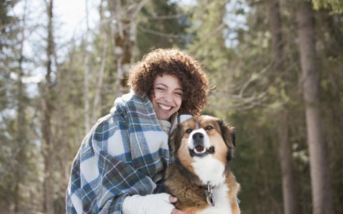 woman with dog smiling