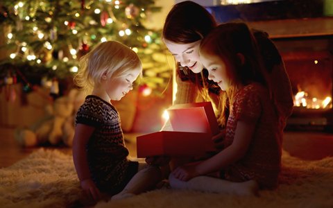 adult and kids opening present