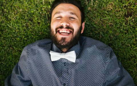 man lying on lawn