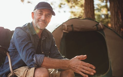 man at campsite