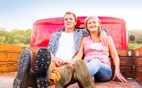 older couple in the back of a truck