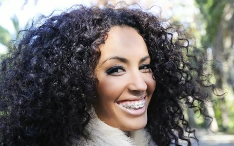 woman in braces smiling close-up